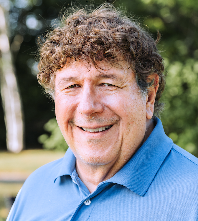 smiling man with brown hair